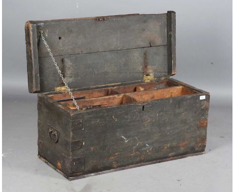 A 19th century pine carpenter's trunk, containing a quantity of moulding planes, chisels and other tools.