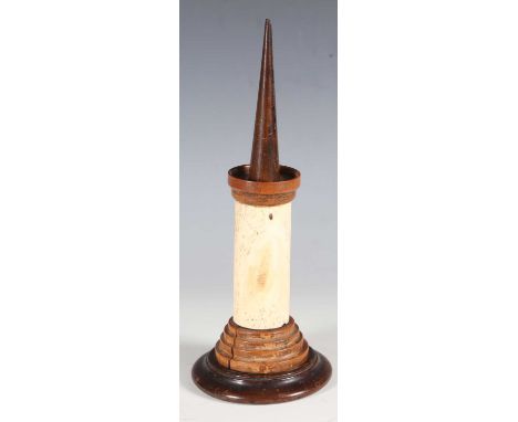 An 18th century bone, boxwood and walnut pricket candlestick, height 29cm.