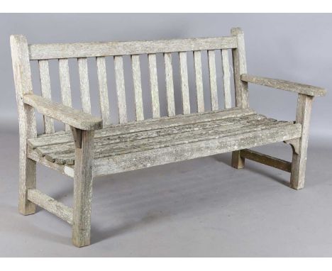 A late 20th century teak slatted garden bench by Lister, height 84cm, width 162cm, depth 66cm.