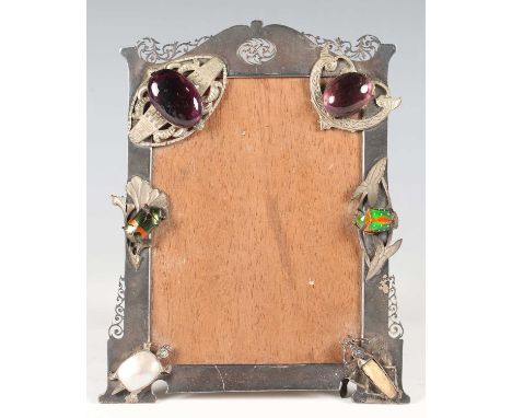 A George V Arts and Crafts silver shaped rectangular photograph frame with pierced decoration, Birmingham 1913 by E.S. Barnsl
