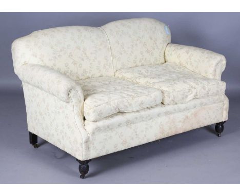 An early 20th century scroll arm two-seat sofa, upholstered in yellow damask, height 86cm, width 150cm, depth 75cm.
