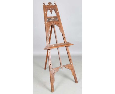 An early 20th century Middle Eastern walnut and mother-of-pearl inlaid easel, similar to those sold at Liberty &amp; Co, heig