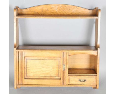 A late Victorian Arts and Crafts ash wall shelf with walnut crossbanded borders, height 63cm, width 61cm, depth 17cm.