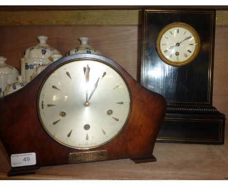Victorian ebonized cased clock with brass inlay, single train movement with silk suspension and enamel dial and a Smith's man