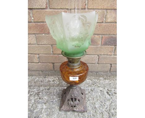 Edwardian oil lamp, art nauveau cast metal base, amber reservoir and green tint shade 