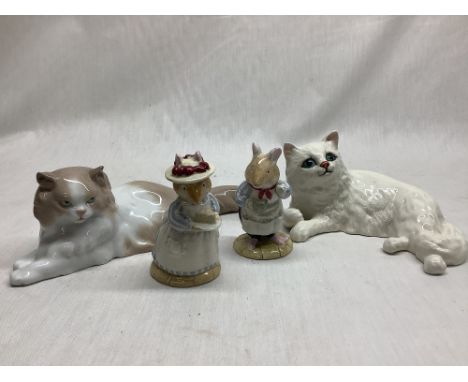 Beswick white reclining cat No 1876 and a Nao reclining cat No, a Royal Doulton Mr apple no.dbh 2 and a Royal Doulton Mrs App