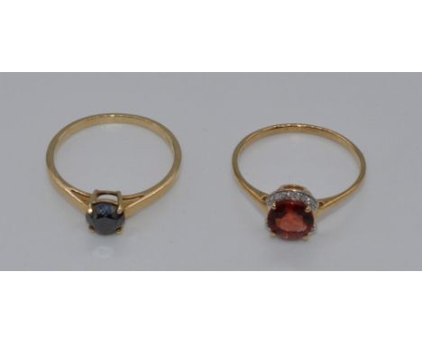 9ct gold ring set with tarraco red andesine and diamonds, size S, 1.7g, and a 9ct gold ring set with a black diamond , size R