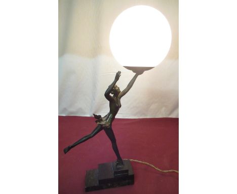 1930's bronzed Spelter table lamp in the form of a ballerina with outstretched arm holding mottled glass globe on stepped mar