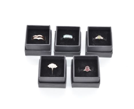 Collection of five sterling silver rings set with gemstones, all stamped 925, including a sterling silver ring set with molda