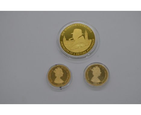 Gold plated Sir Winston Churchill portrait of a British statesman commemorative coin, and two ERII gilt metal 2015 Gibraltar 