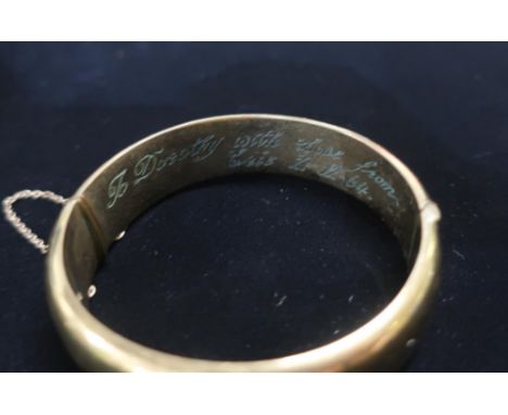 Rolled gold hinged bangle with safety chain stamped 25.3g gross 