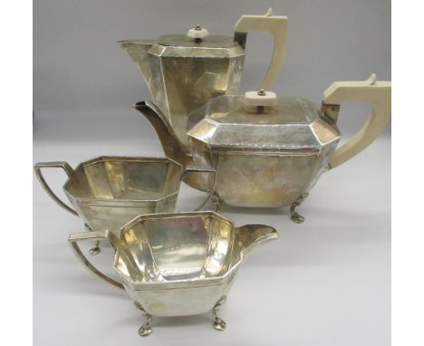 Geo. VI Art Deco design silver four piece tea set. Comprising of a coffee pot, teapot with angular ivory handles and lid, a m