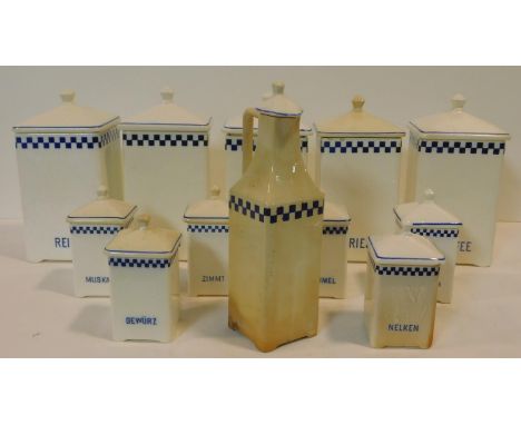 A collection of German blue and white vintage food storage jars and matching oil bottle. Each with lids and name of contents 