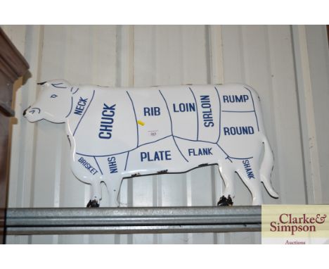 An enamel cow sign