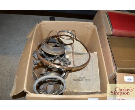 A collection of various brass lamp parts including burners and wicks