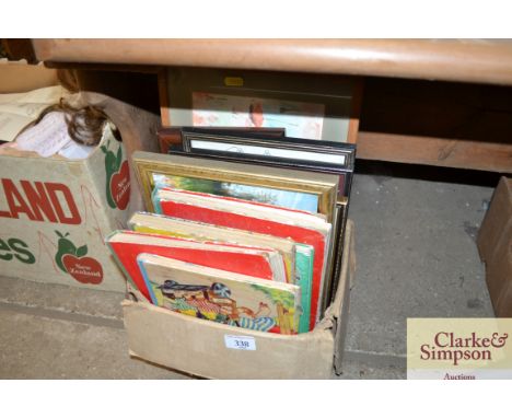 A box containing various children's annuals and various pictures and prints 