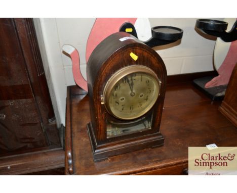 An oak cased two hole mantel clock 