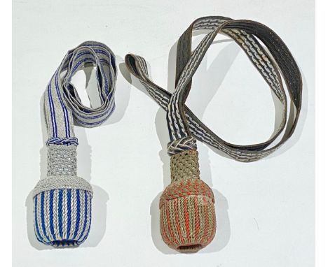 Two German Sword Knots, Portapees.The first example of silver bullion with blue line decoration. Near VGC ... The second with