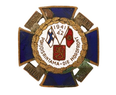 German Third Reich / Finnish 1941-43 North Front breast badgeA good scarce example of a blue enamel cross pattée with swastik
