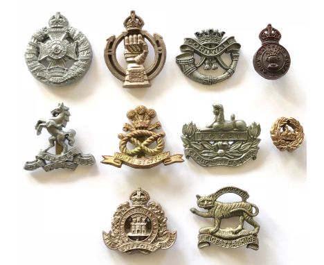 10 WW2 plastic economy cap badges.Rifle Brigade ... Royal Armoured Corps ... Duke of Cornwall’s Light Infantry ... Catering C