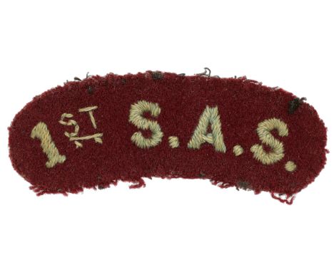 1st S.A.S. attributed WW2 Special Air Service cloth SAS shoulder title.Good light blue embroidered sans-serif letters on maro