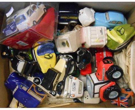 A box containing a quantity of ceramic and other novelty car egg cups, cruets and trinket boxes
