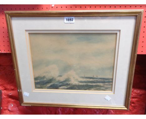 A. Hulk: A gilt framed watercolour, depicting a seascape with sails in the distance, signed - faded to buff