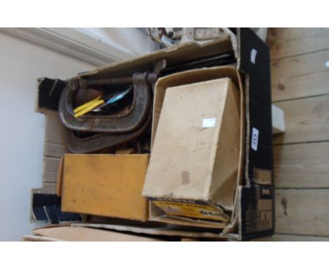 A box of assorted carpentry tools including Record plough plane, Stanley Bailey No.4 plane, clamps, etc.