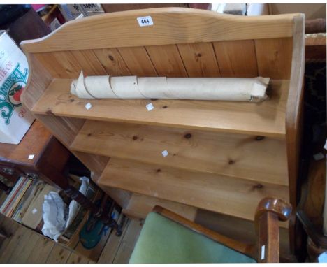 An 84cm modern waxed pine four shelf open bookcase, set on bracket feet