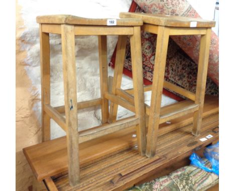 Two vintage mixed wood school science stools