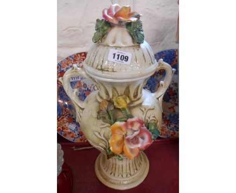 A vintage Capodimonte lidded vase with floral decoration