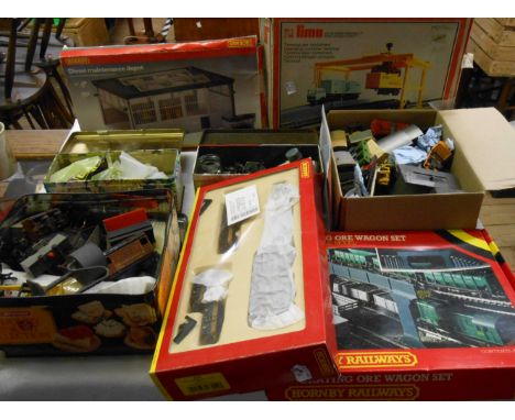 A box containing assorted railway systems including Lima container terminal, Hornby maintenance depot, Hornby ore wagon set, 