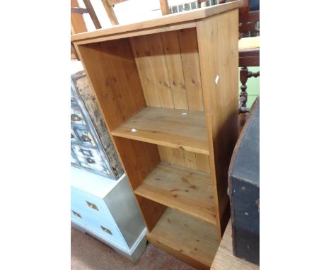 A 60cm modern pine three shelf open bookcase