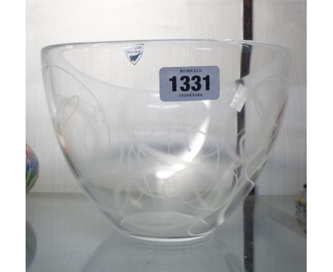 An Orrefors Swedish art glass bowl decorated with all over swirl pattern with acid etched mark to base and foil label
