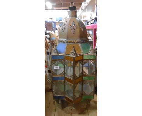 A large Moroccan style stained glass and brass hanging ceiling lantern