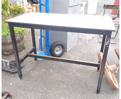 A vintage school science table with formica top and painted metal base