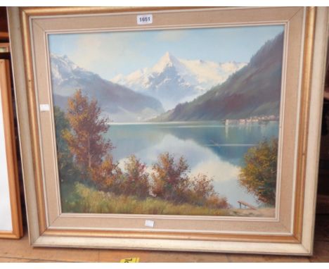 A framed vintage oil on canvas, depicting a mountain lake landscape - signed - various holes to canvas