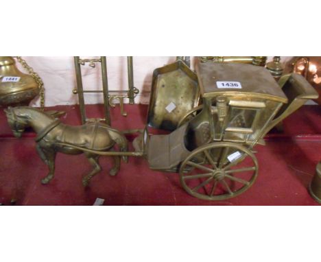 A large vintage cast brass model of a horse and carriage