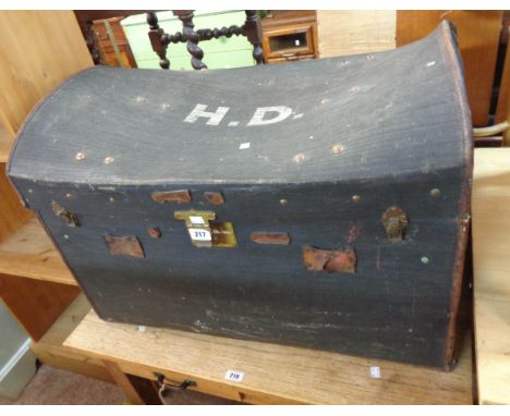 An 80cm early 20th Century weather coated dome-top travelling trunk with H.D initials to lid and flanking leather carrying ha
