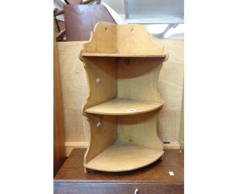 An old waxed pine three shelf corner unit