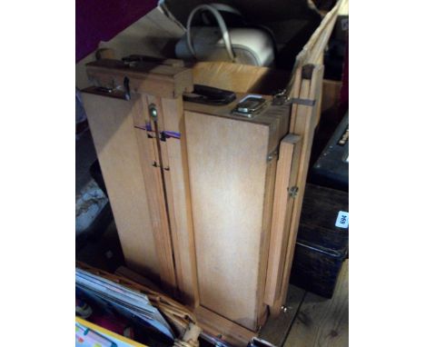 A wooden travelling table easel