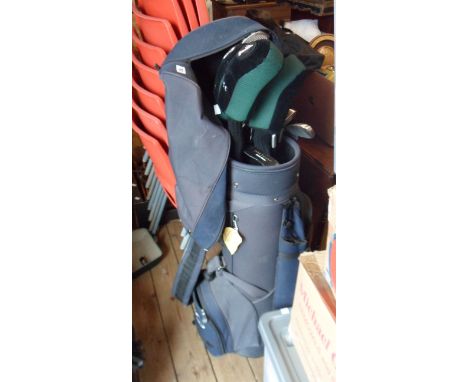 A set of John Letters golf clubs in caddy bag