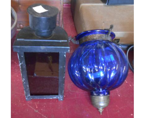 An old black japanned tin hand held signalling lamp - sold with a modern blue glass hanging lantern