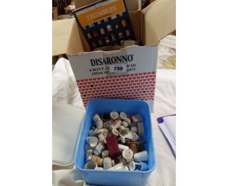 A box containing a large quantity of collector's thimbles including Royal Worcester, Wedgwood, Mintons, Caverswall, cloisonne