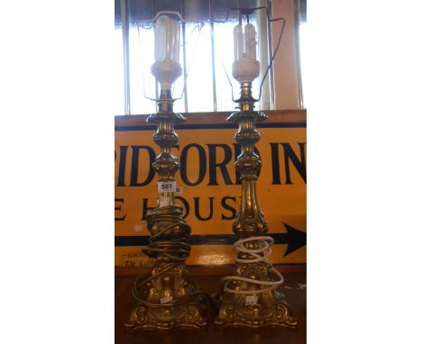 A pair of modern cast brass Rococo style candlestick form table lamps