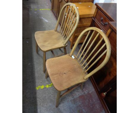 Two similar vintage hoop stick back kitchen chairs, both with solid elm moulded seats, set on turned supports