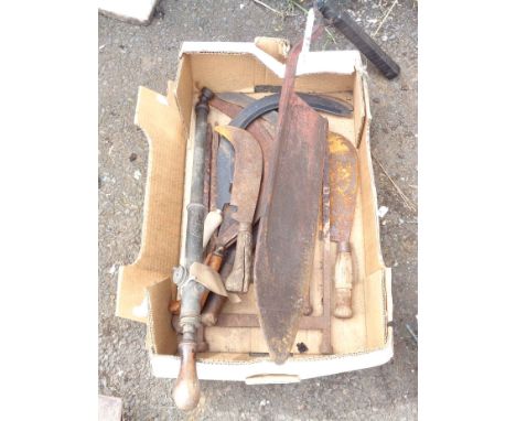 A box containing assorted tools and metalware including boot scrapers, hay knife, etc.