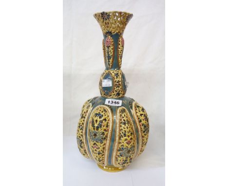 An Art Nouveau Zsolnay Pecs vase decorated with reticulated lobed panels and collar