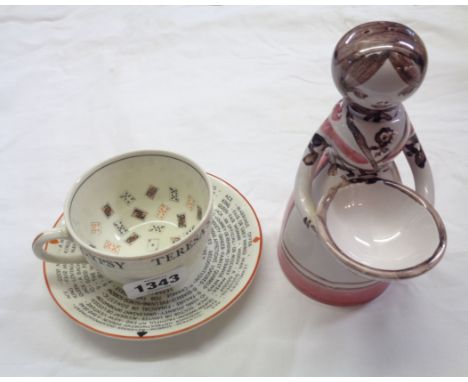 A vintage pottery Gypsy Teresas's Fortune Telling cup - sold with a Danish pottery woman form cruet