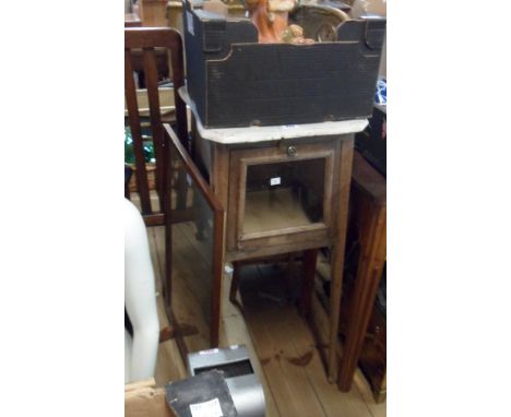 An old French stained wood washstand with shaped top and glazed top hinged door, set on slender square tapered supports - wea